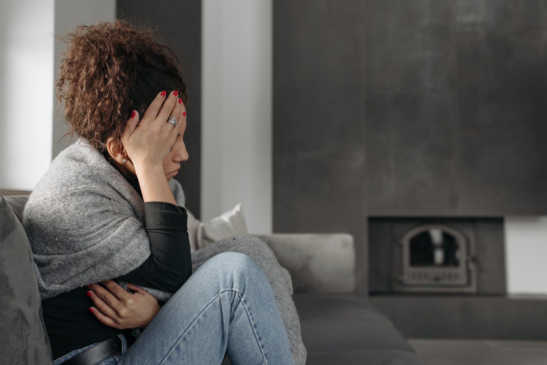 woman touching her head